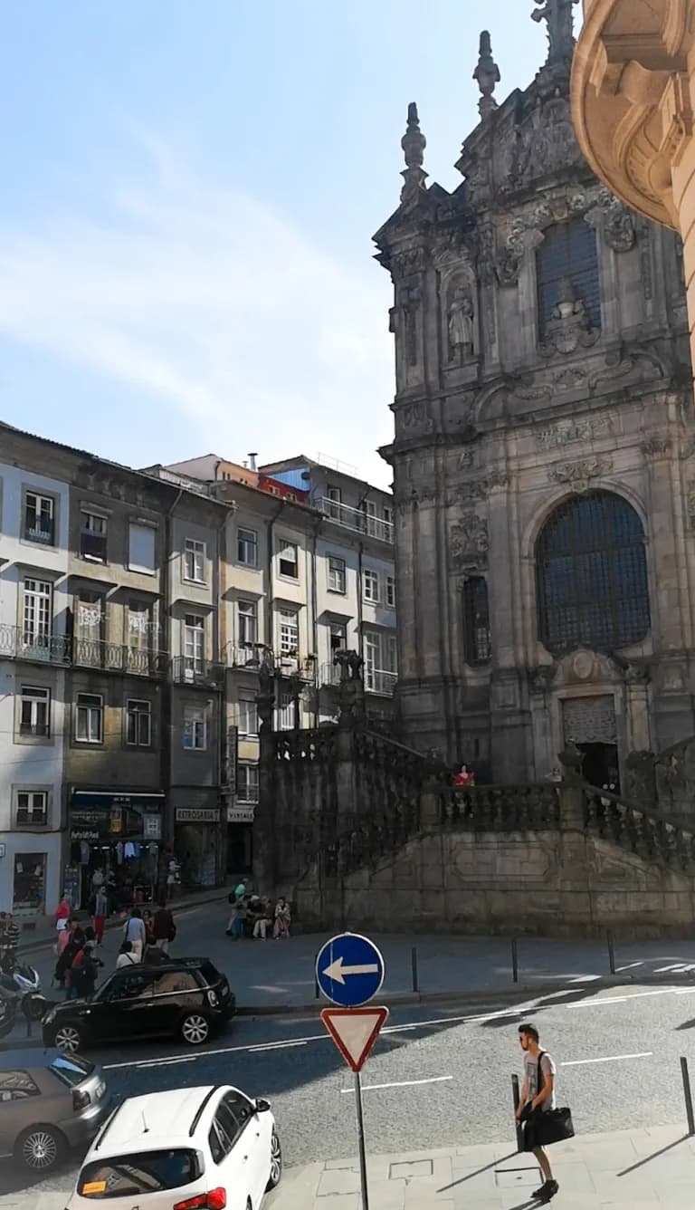 Picture of downtown porto streets with an old gothic church.