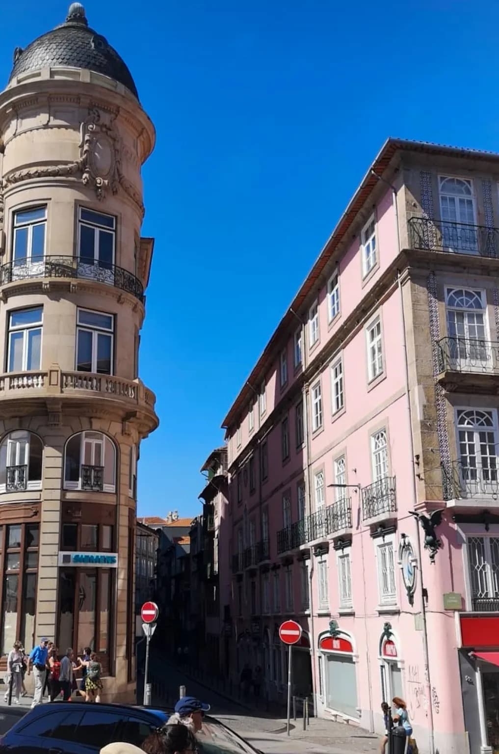 Picture of downtown porto side street with a spanish colored buildings.